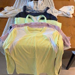 Lululemon tops. Set of 5. 2- tanks. 2- long sleeve 1 tshirt great condition